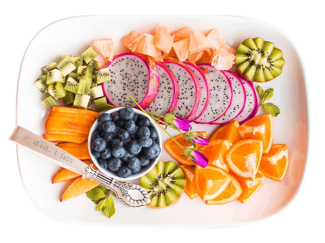 Vibrant tropical fruit platter with dragon fruit and more, shot from above.